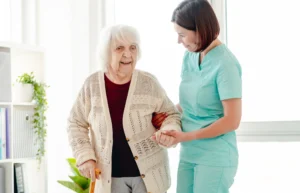 Elder lady getting help walking